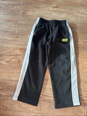 Nike Black Joggers with Gray Side Panels and Neon Yellow Logo